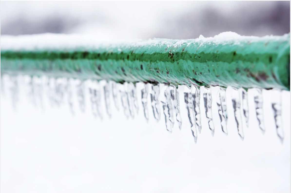 Icicles hanging from frozen pipe