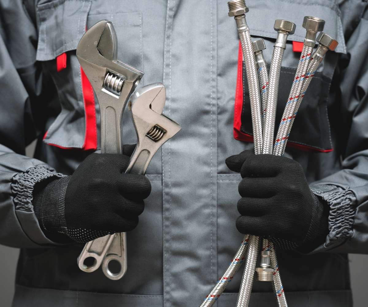 plumber with tools in hands
