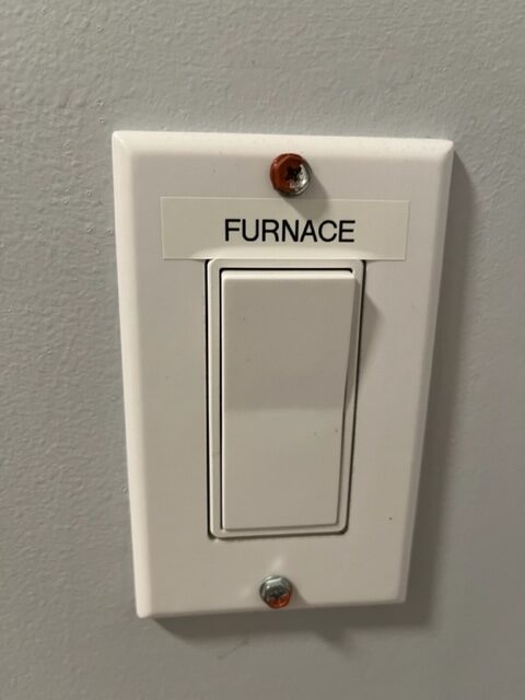 Properly labelled furnace "on/off" switch.
