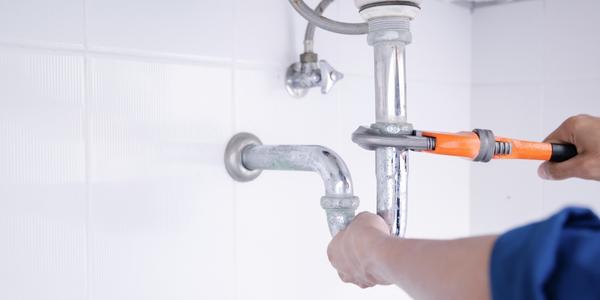 https://www.johnsadler.ca/wp-content/uploads/2022/11/Plumber-working-in-the-bathroom-plumbing-repair-service.jpg