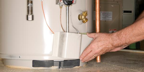 https://www.johnsadler.ca/wp-content/uploads/2022/11/checking-water-heater.jpg