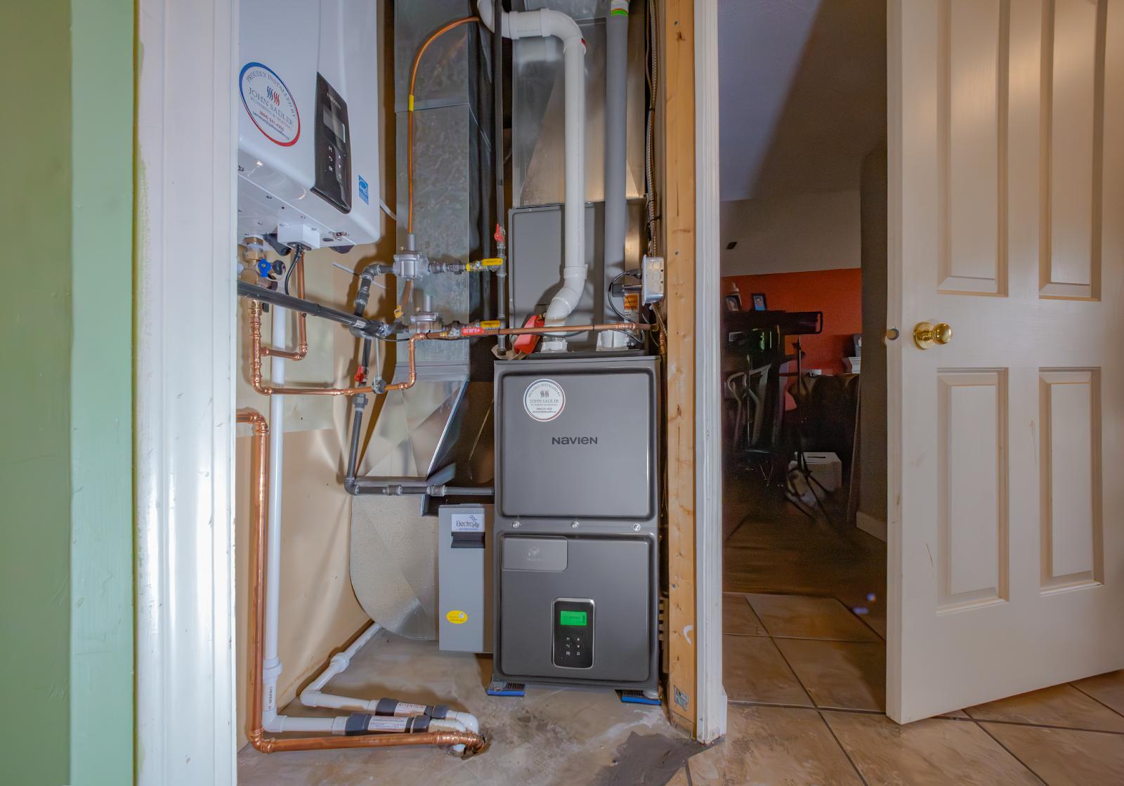 Navien furnace installation by John Sadler Plumbing & Heating.