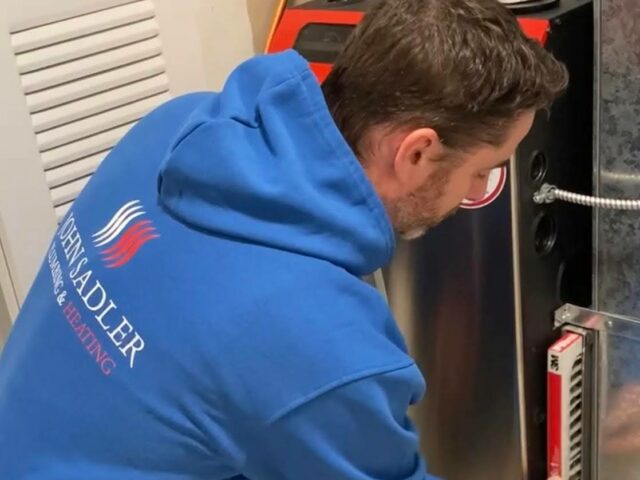 Screenshot John Sadler furnace technician changing a furnace filter.